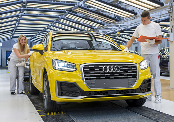 Start of series production of Audi Q2 at main plant in Ingolstadt – employees applies their trained eyes to inspect an Audi Q2 before it leaves the assembly line.